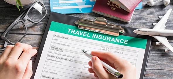 Travel insurance form being filled, representing 24/7 global travel assistance in San Marcos, TX.