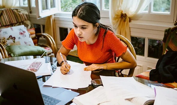 Student researching college scholarship benefits and assistance in Kyle, TX.