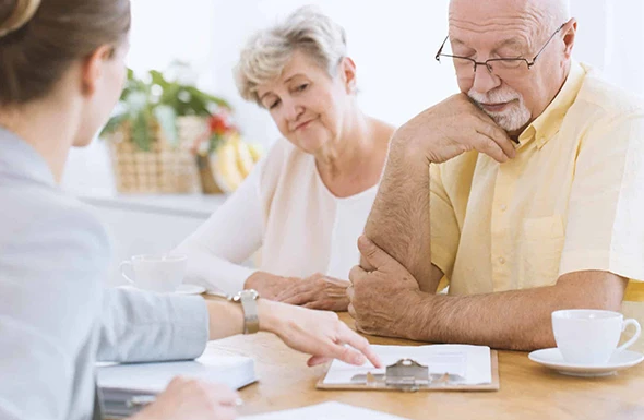 A family meeting with a financial advisor to discuss the benefits of life insurance.