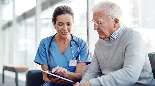 Nurse reviewing Medicare options with senior patient in Kyle, TX.