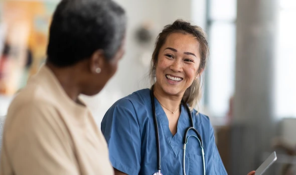 A woman receiving a consultation on the benefits of Obamacare consultation services.