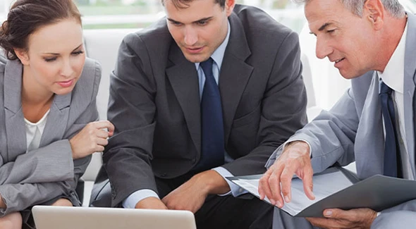 Wealth management team assisting clients with financial planning and investment strategies.