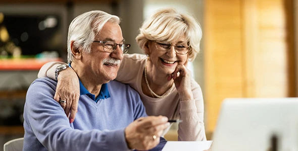 Senior couple reviewing life insurance plans for their family in Wimberley, TX.