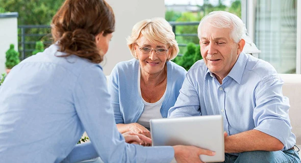 Senior couple reviewing Medicare options with their advisor in Kyle, TX.