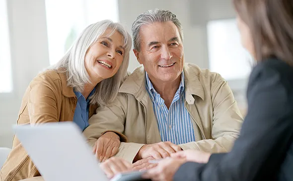 Senior couple discussing how to get immediate annuities in Wimberley, TX.