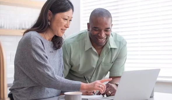 Insurance agent assisting a client with health insurance marketplace enrollment in Buda, TX.