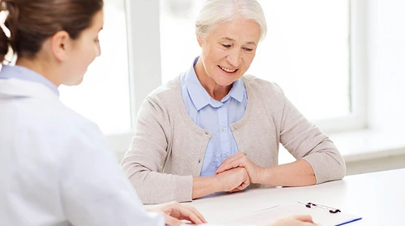 Senior woman reviewing Medicare Advantage options with advisor in Wimberley, TX