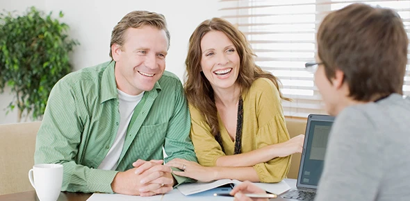 Couple consulting with advisor about Medicare enrollment in Dripping Springs, TX.