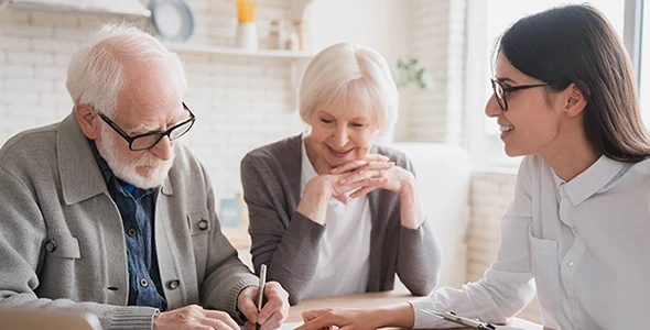 Agent discussing Medicare supplement insurance options with a senior couple in Wimberley, TX.
