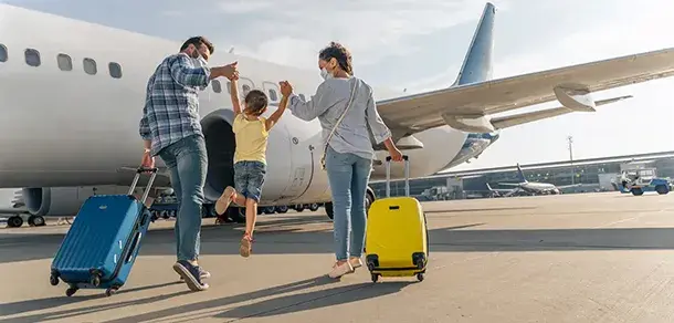 Family with luggage preparing for a trip, covered by reliable family travel insurance in Dripping Springs, TX.