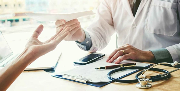 A health insurance agent reviewing small business health insurance options with a client in Dripping Springs, TX.