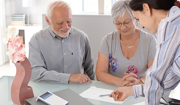Couple reviewing Social Security optimization and claiming guidance with advisor in San Marcos, TX.