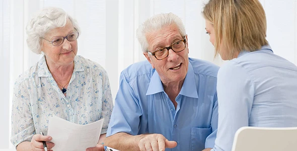 Seniors discussing Medicare options with local Medicare agents in Buda, TX.